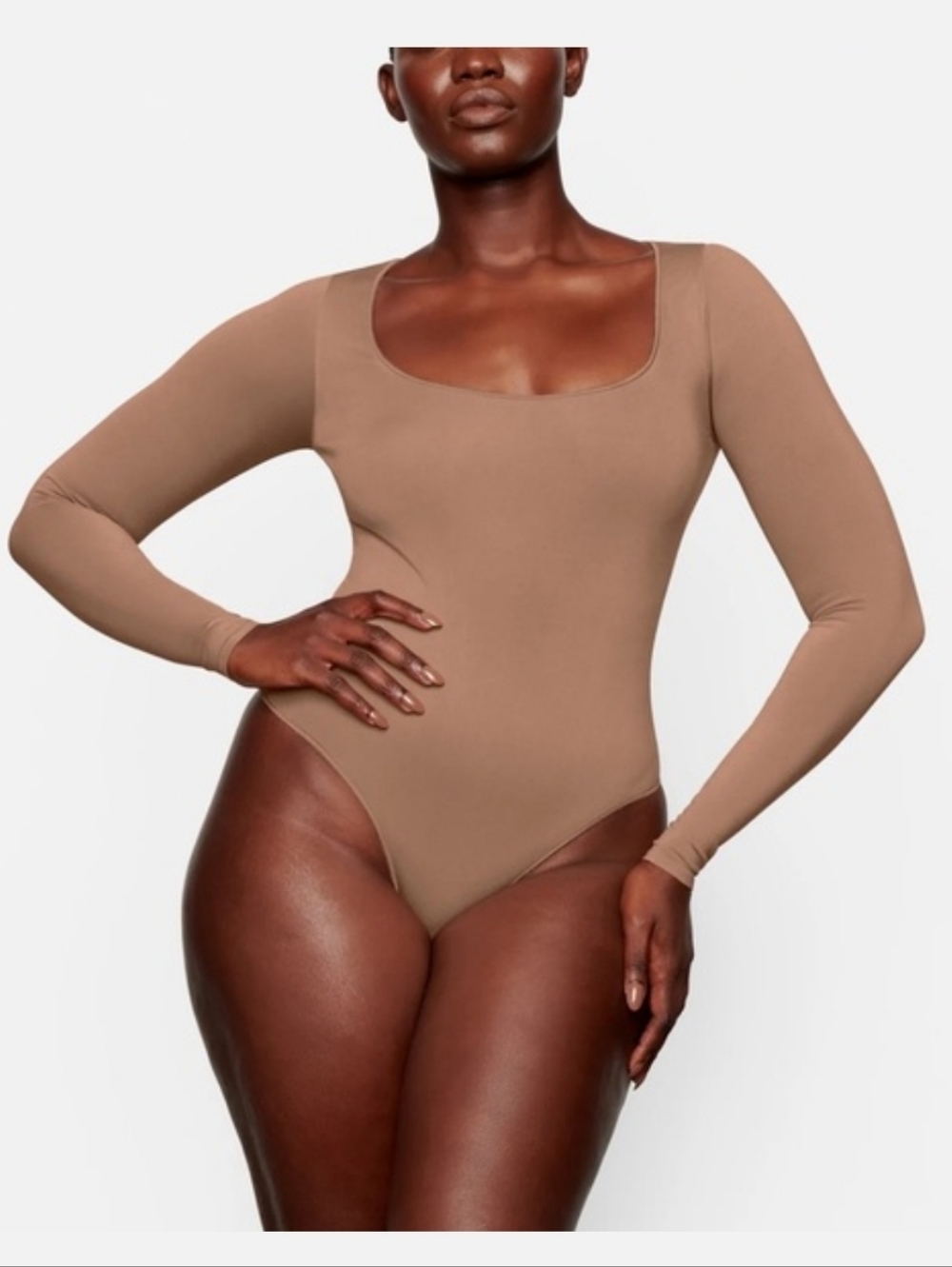 Skims Essential Smoothing Scoop Neck Tan Raw Hem Long Sleeve Thong Bodysuit